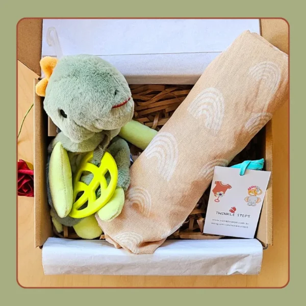 Twinkle Steps Minty Dino baby cuddle gift box with snuggler and muslin wrap