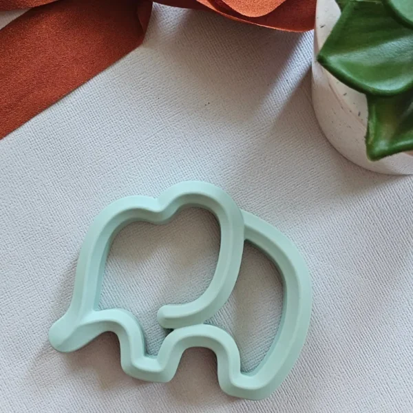 Mint green elephant-shaped silicone baby teether for infant gum relief