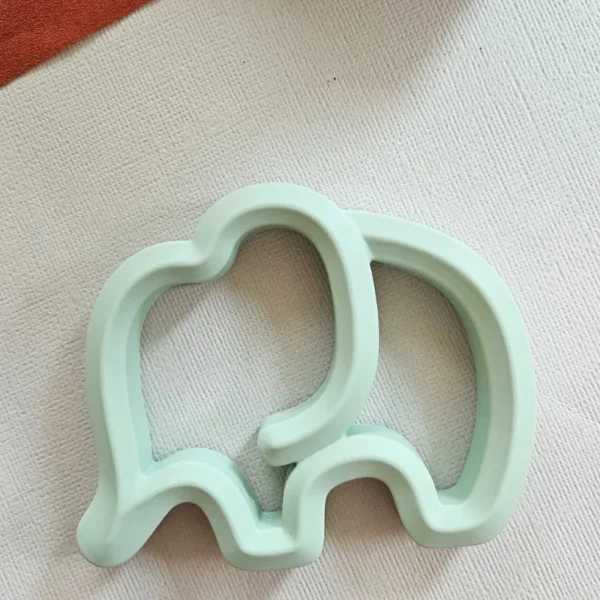 Mint green elephant-shaped silicone baby teether for infant gum relief