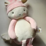 Close-up detail of the locally sourced, sustainable baby plush toy being held gently to display its premium, cloud-like texture.